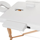Masa pliabila de masaj din lemn cu intalime reglabila,pat cosmetica piele ecologica alba, latime 70 cm